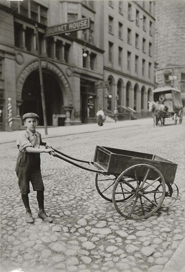 Lewis W Hine, (A Part-time Office and Delivery Boy on cobblestone road in front of Burnet House building) , circa 1920's ,Vintage Gelatin Silver Print.